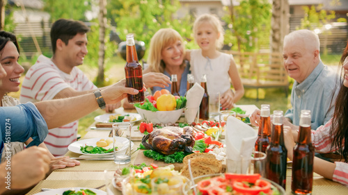 Big Family Garden Party Celebration, Gathered Together at the Table, Eating, Joking and Having Fun.