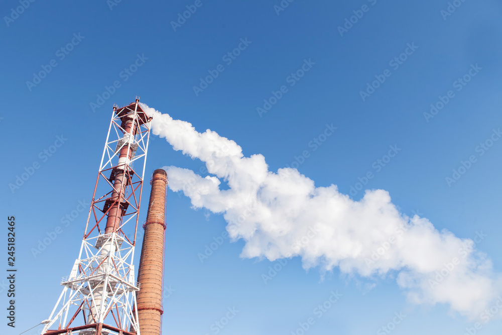 Obraz premium Smoke from the factory pipes. Ecological problem, mining enterprise with smoke stacks. Dirty smoke on the sky. Environmental issues. harmful emissions. Bad ecology. - Image