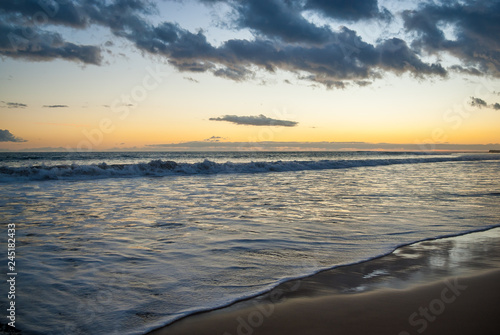 Sandy coast of the island  waves. Tourism  tranquility  vacation at sea  cruise. Evening at sea