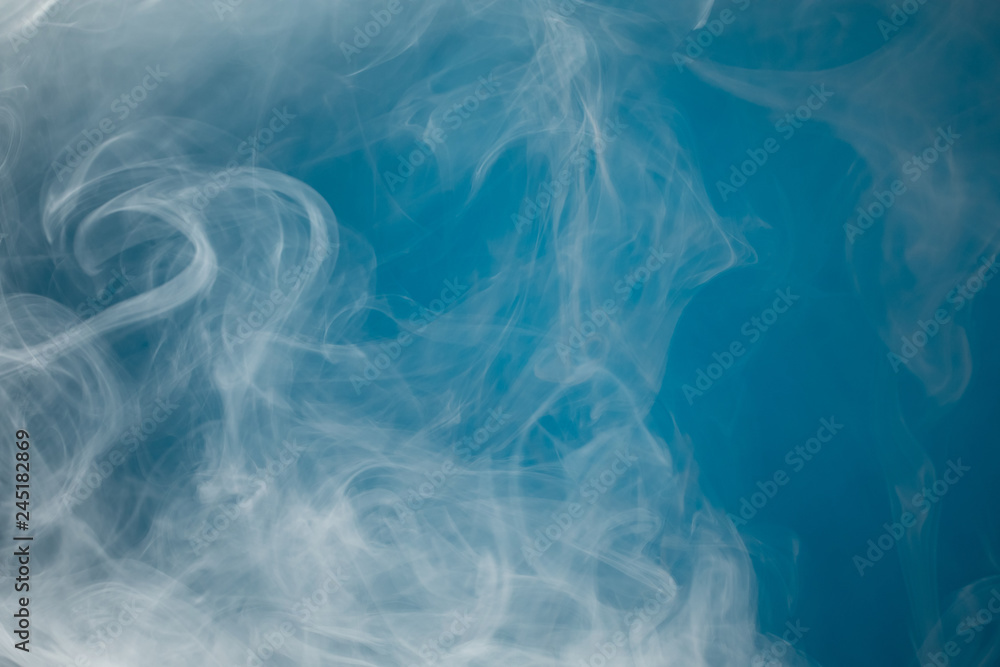 dense smoke on blue background dense smoke on blue background