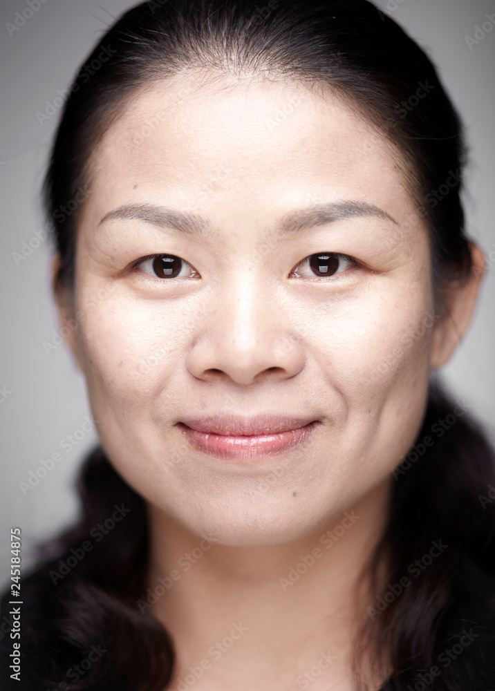 Portrait of young Asian women. Indoors white background Portrait of young Asian women. Indoors white background