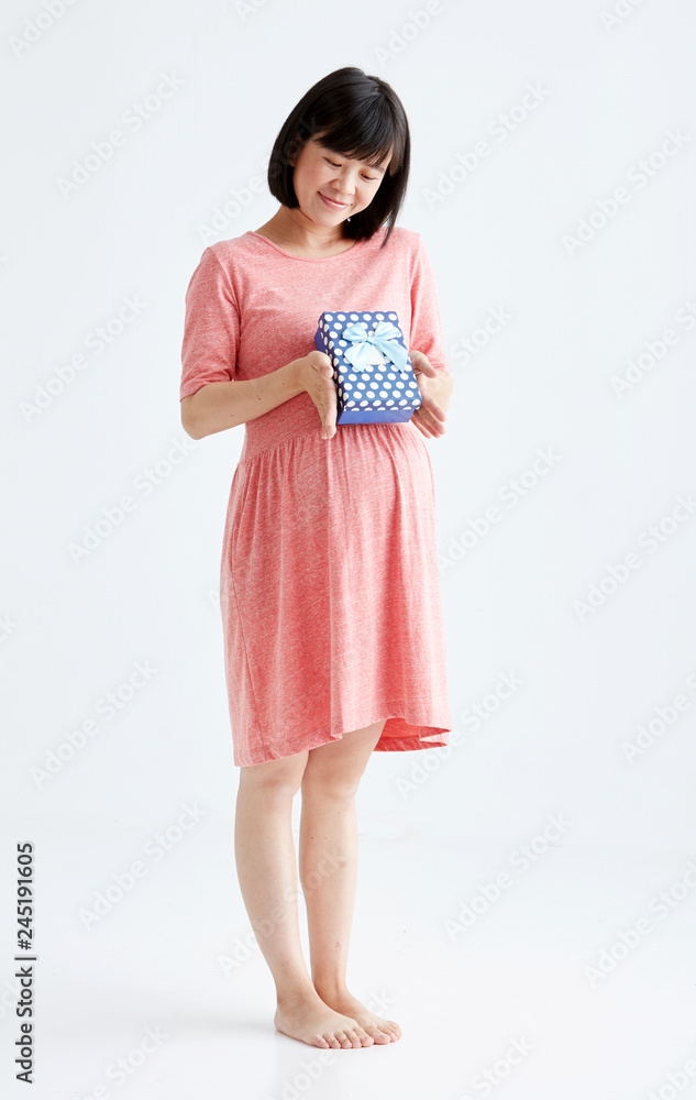 Pregnant woman waiting for a desired baby with gift ,White background in studio Pregnant woman waiting for a desired baby with gift ,White background in studio