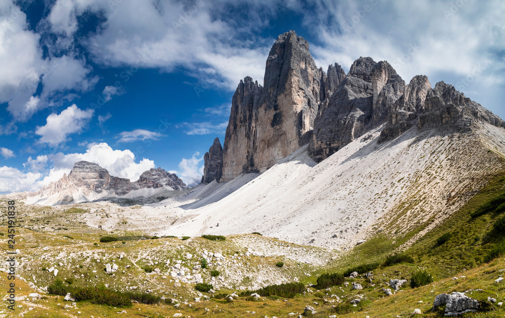 Summer view of Tre Cime di Lavaredo with rocky foreground in the Dolomites, South Tyrol, Italy