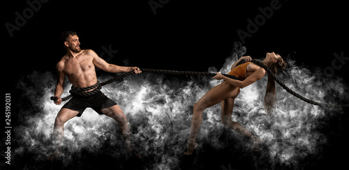 Couple working out with battle ropes at gym © Andrey Burmakin