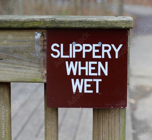 A close view on the brown slippery when wet sign. 