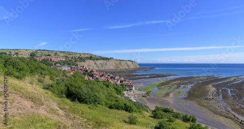 View of the village and the bay at low tide, Robin Hood's Bay, England, United Kingdom, Europe photo