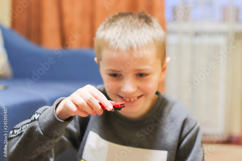 Happy child 6-8 years play with his car toy