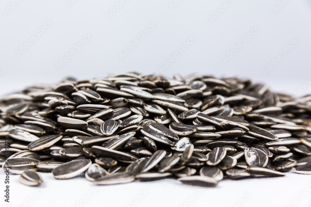 pile of sunflower seeds isolated on white background