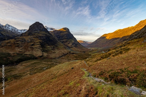 Hiking trail in mountain scenery with peaks of Stob Coire nan Lochan, Glen Coe, west Highlands, Scotland, United Kingdom, Europe photo