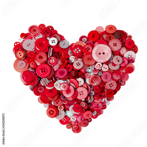 Red heart made with many buttons on a white background. Scarlet heart isolated.