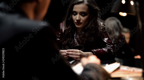 Billede på lærred Female witness gives evidence in interrogation room, detective writing testimony