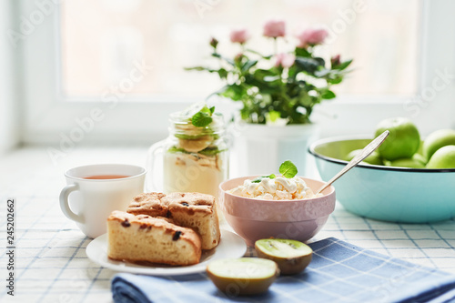 Cheesecakes and cottage cheese with tea. Delicious cheesecake on table. Copy space. Concept of Russian and Ukrainian cuisine. Romantic breakfast. Mother's Day Greeting Card. Healthy food. Women's Day