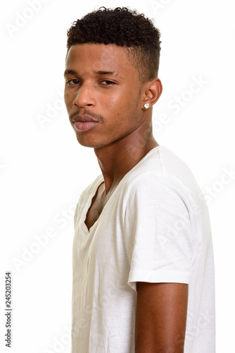 Young handsome African man isolated against white background © Ranta Images