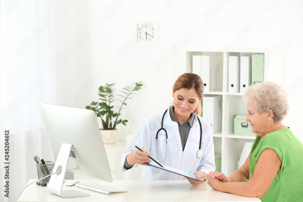 Doctor working with elderly patient in hospital Doctor working with elderly patient in hospital