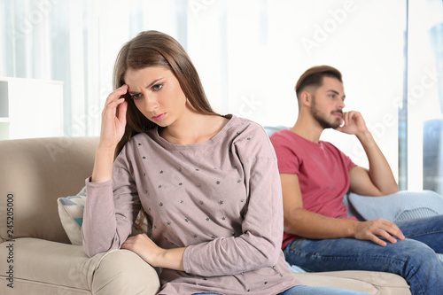 Young couple with relationship problems in living room