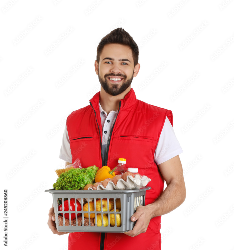 Man holding basket with fresh products on white background. Food delivery service Man holding basket with fresh products on white background. Food delivery service