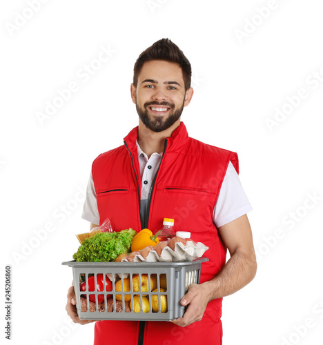 Man holding basket with fresh products on white background. Food delivery service