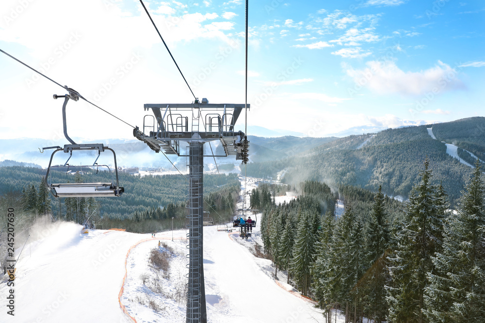 Beautiful mountain landscape with chairlift. Winter vacation Beautiful mountain landscape with chairlift. Winter vacation