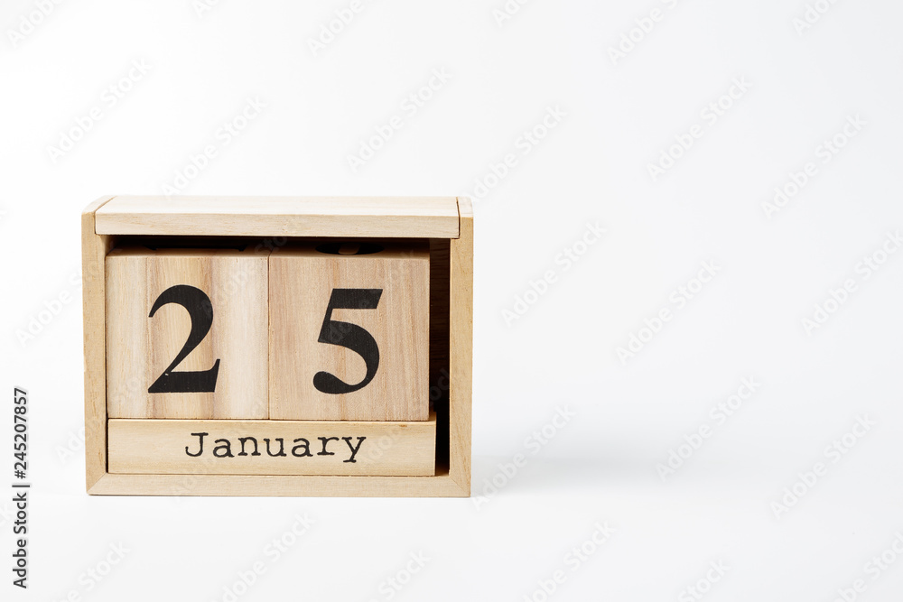 Wooden calendar January 25 on a white background Wooden calendar January 25 on a white background