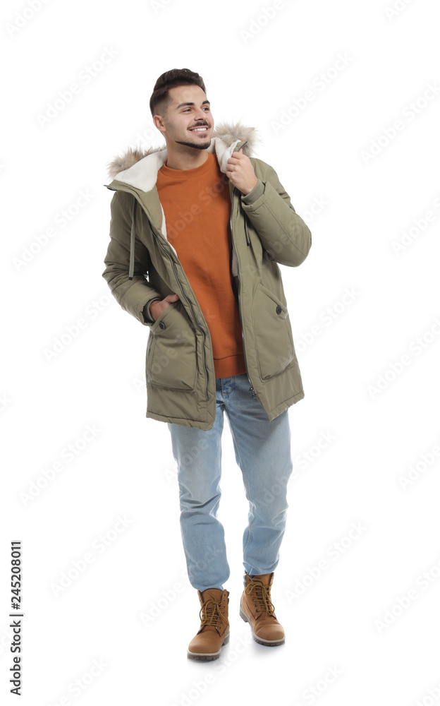 Young man wearing warm clothes on white background. Ready for winter vacation Young man wearing warm clothes on white background. Ready for winter vacation