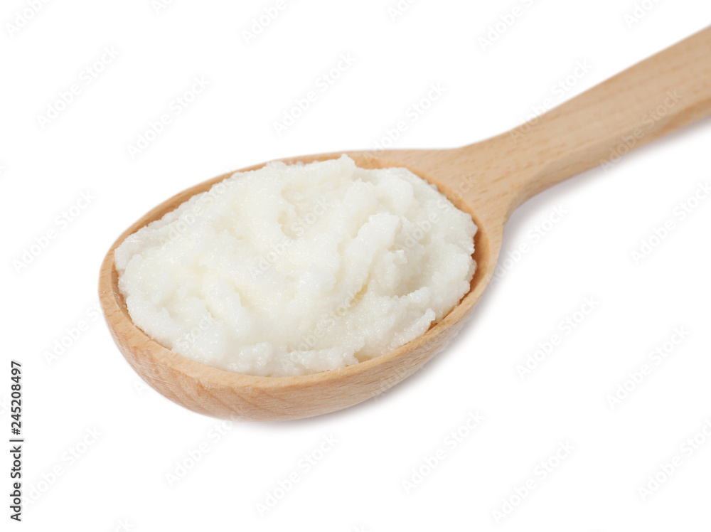 Shea butter in wooden spoon isolated on white Shea butter in wooden spoon isolated on white