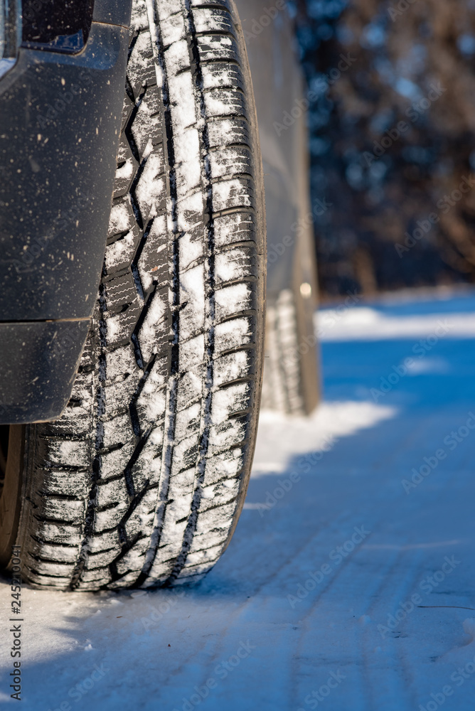 Car tire in the snow Car tire in the snow