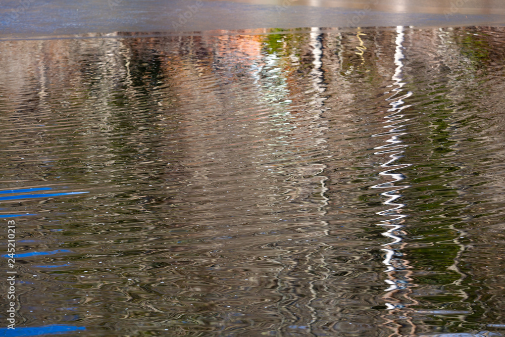 Reflection of forest on a icy pond in Camden, Maine Reflection of forest on a icy pond in Camden, Maine