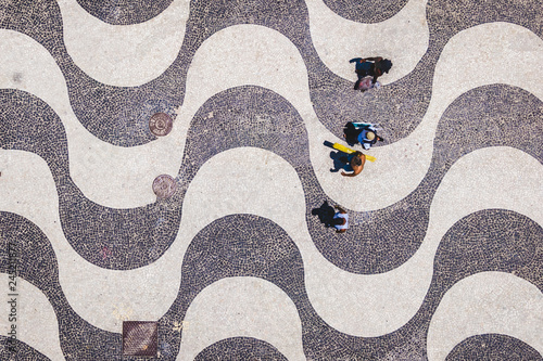 фотографія Rio de Janeiro, Brazil, Top View of People Walking on the Iconic Copacabana Beac