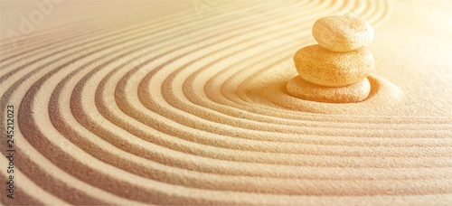 Photography Japanese zen garden with stone in raked sand