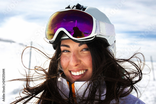woman with beautiful smile with ski helmet