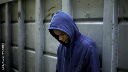 Upset afro-american guy feeling lonely, lack of friends, misunderstanding photo