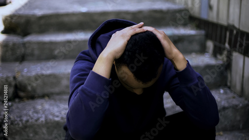 African american boy became orphan, feeling pain of loss and fear for future