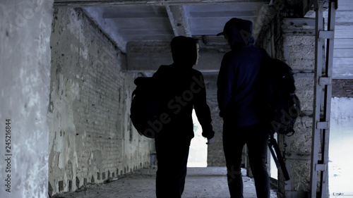 Teenagers skipping classes in abandoned house, lack of extreme in life, walking