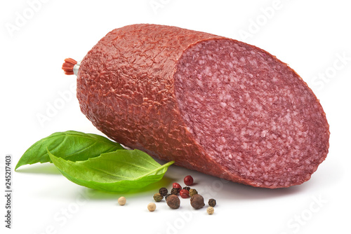 Dried Salami Sausage with basil and peppercorns, close up, isolated on a white background