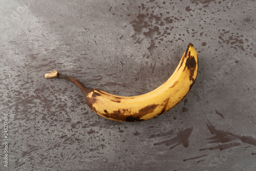 Ripe banana on a gray counter top