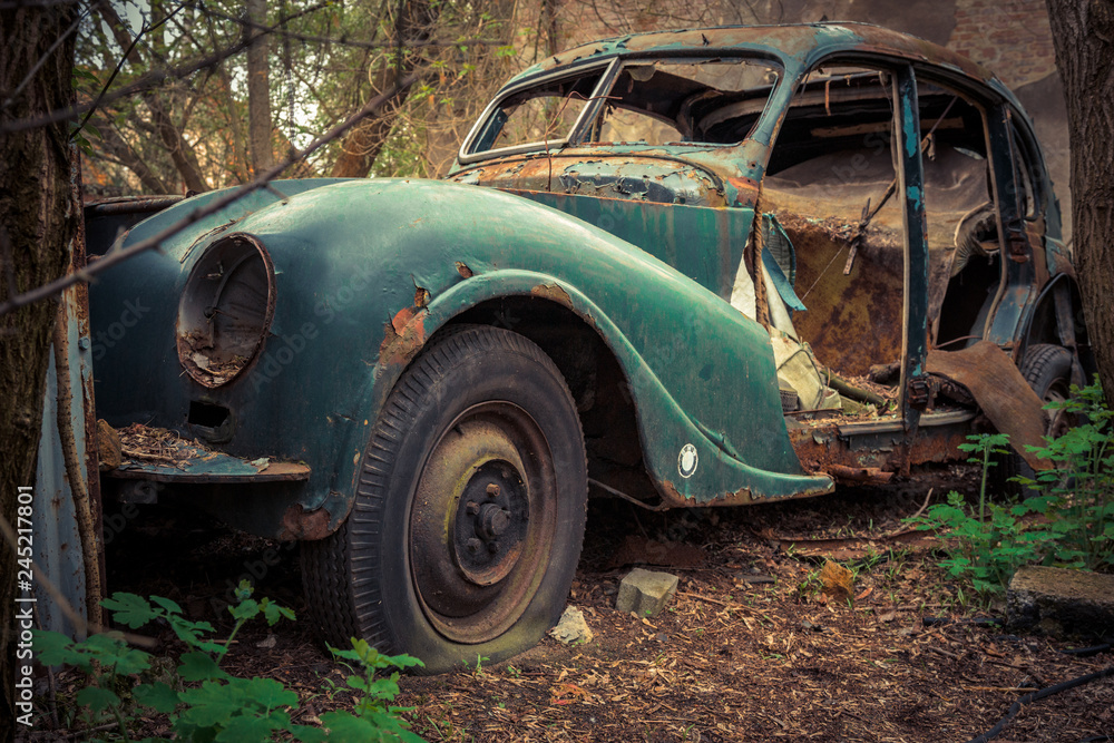 Destroyed and abanoded car in an abandoned place Destroyed and abanoded car in an abandoned place