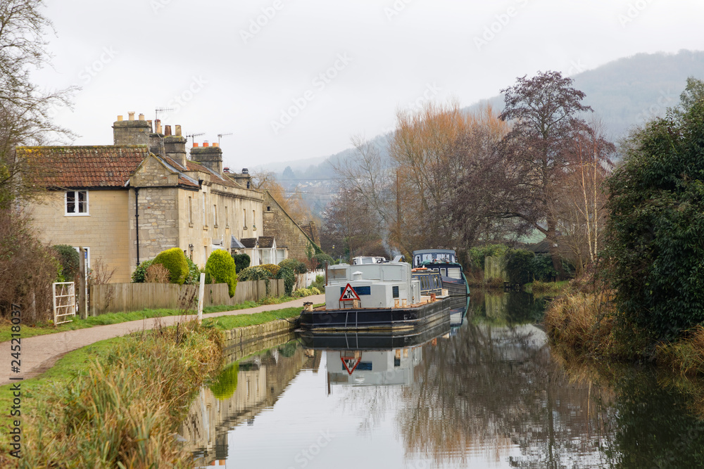 Narrow boats in the Kennet and Avon canal  in the city Bath in England