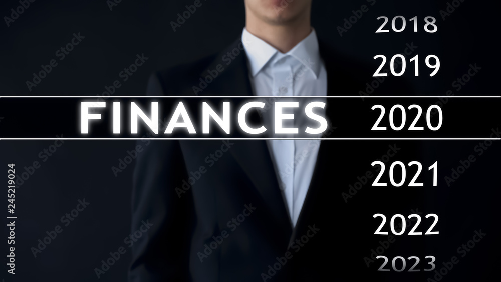 Businessman selects 2020 finances report on virtual screen, money statistics Businessman selects 2020 finances report on virtual screen, money statistics