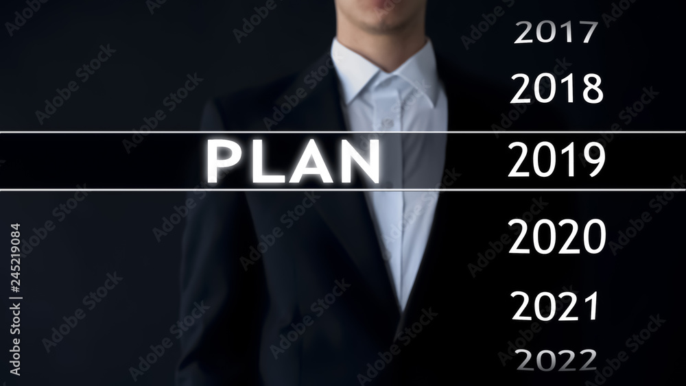 Plan for 2019, businessman chooses file on virtual screen, startup strategy Plan for 2019, businessman chooses file on virtual screen, startup strategy