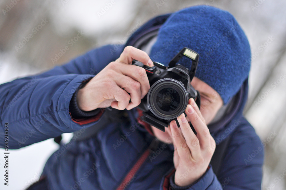 A man takes pictures in a hat and jacket. Portrait. A man takes pictures in a hat and jacket. Portrait.