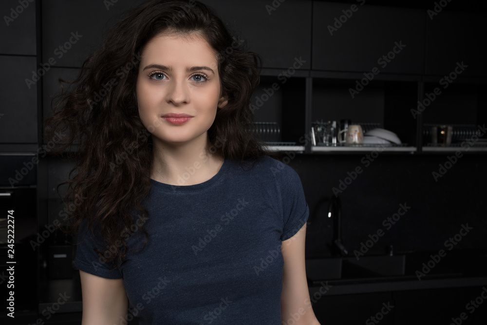 Portrait of beautiful young woman with voluminous curly hair Portrait of beautiful young woman with voluminous curly hair