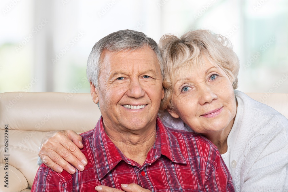 Portrait of happy senior couple smiling at home Portrait of happy senior couple smiling at home
