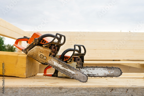 When construction a wooden house, two chainsaws a bit.