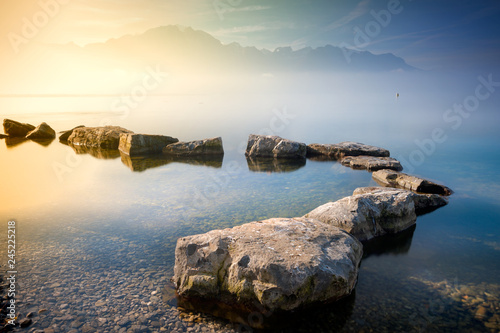 Scenic view of stepping stones in lake photo