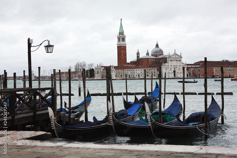Gondolas in Venice Italy Adriatic sea. Markusdom. St Mark's Basilica Square. Saint Marco Square.