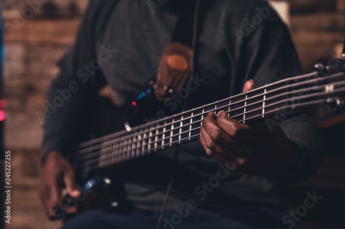 African American Playing Electric Guitar Close up on Hands and Strings