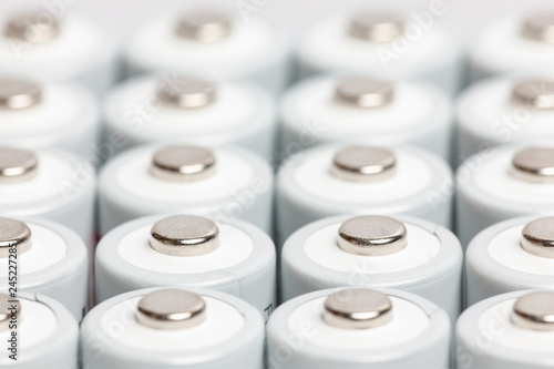 AA batteries are close to each other. Close-up of white batteries on a white background. Battery technology