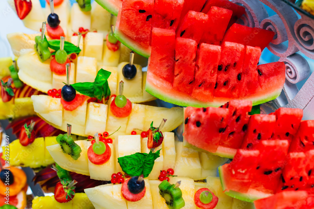 A top view of fresh fruit that is decorated with other fruits on the stand A top view of fresh fruit that is decorated with other fruits on the stand