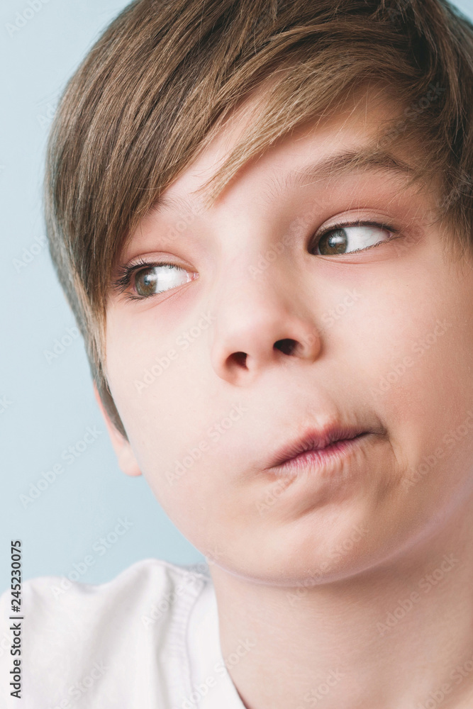 Surprised boy twisted his mouth in grimace of perplexity Surprised boy twisted his mouth in grimace of perplexity