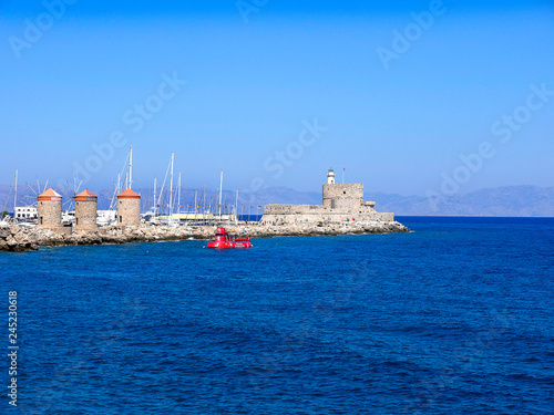 The sights on Mandraki Harbour on the island of Rhodes a popular tourist attraction